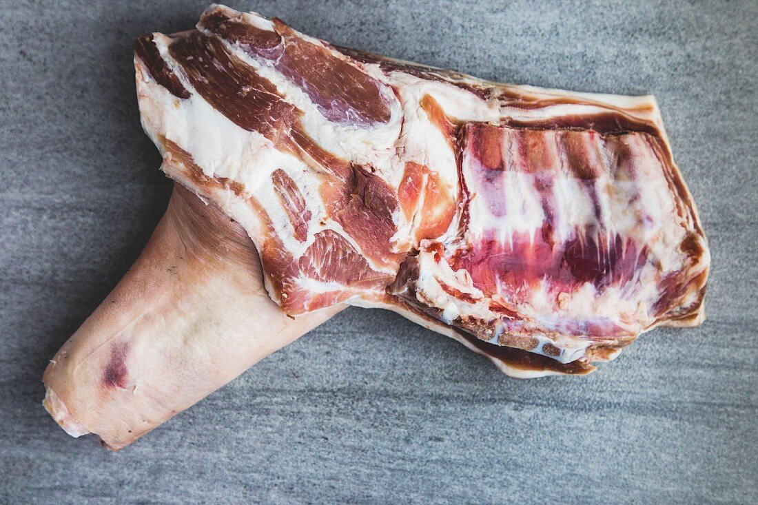Raw free-range, organic pork leg (seen from above)