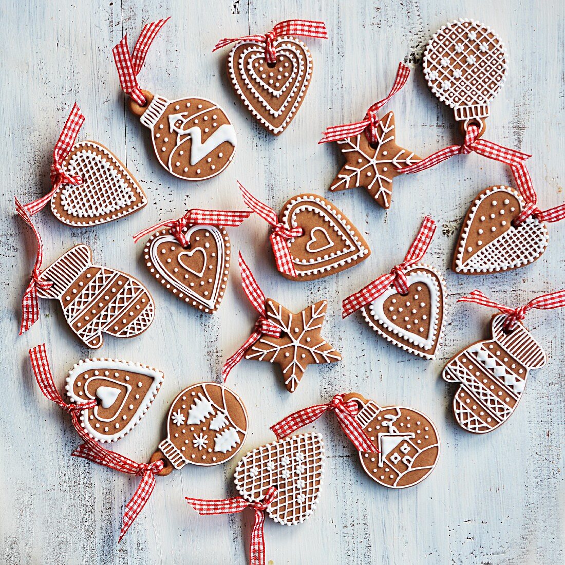 Various gingerbread biscuits decorated with white icing