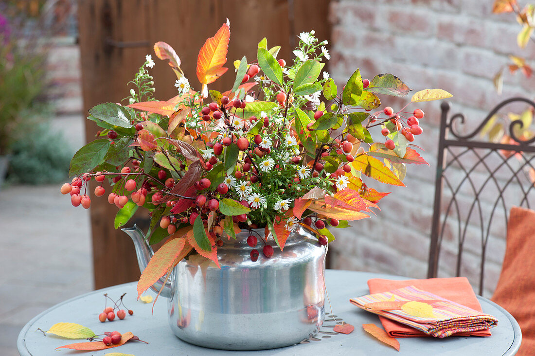 Autumn bouquet of branches of malus (ornamental apple) with fruits