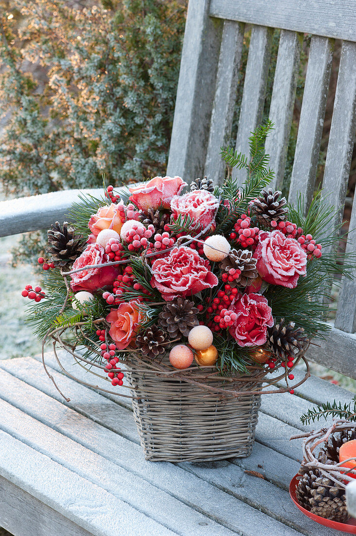 Frozen Christmas bouquet of Rosa (roses), Pinus (pine)