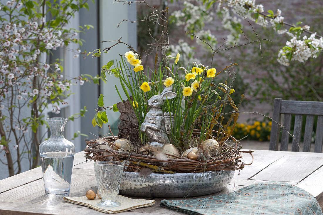 Silver bowl with narcissus, easter bunny and easter eggs