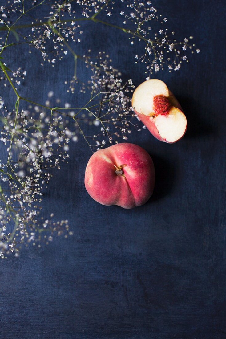 Fresh peaches on a dark background