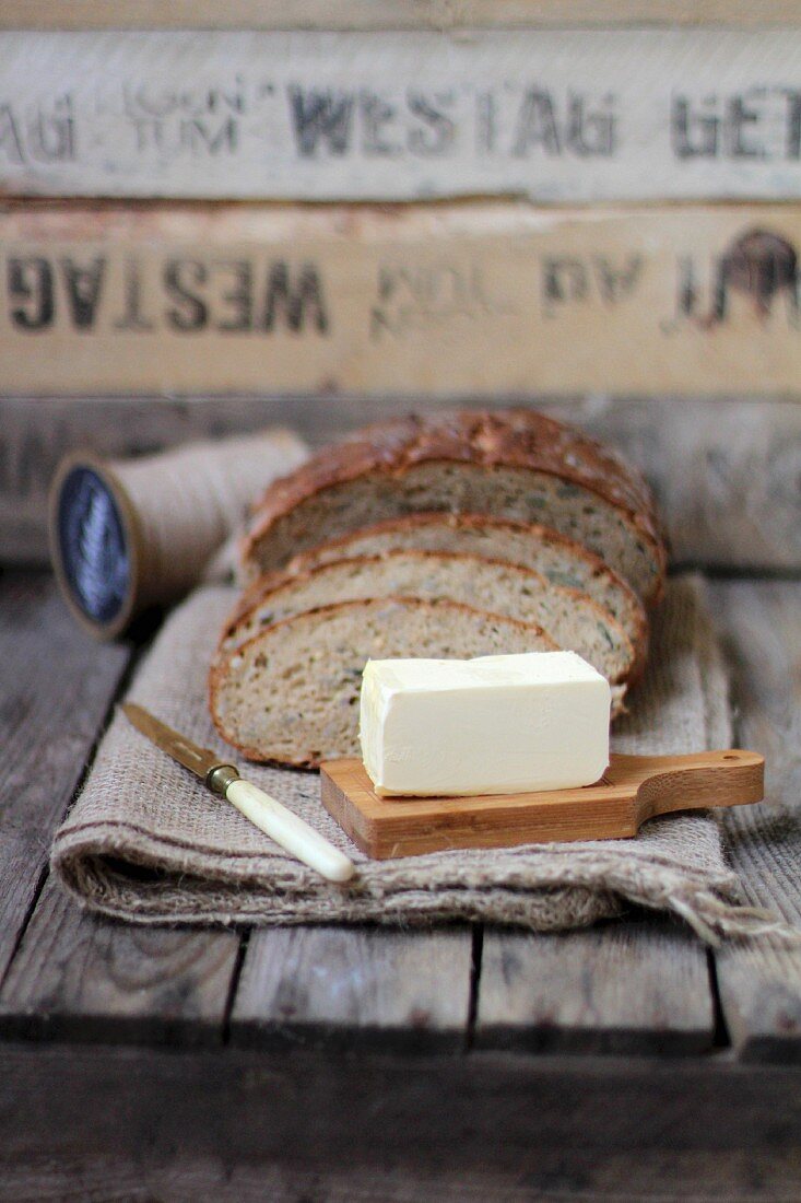 Butter and Stacked Slices of Wheat Bread