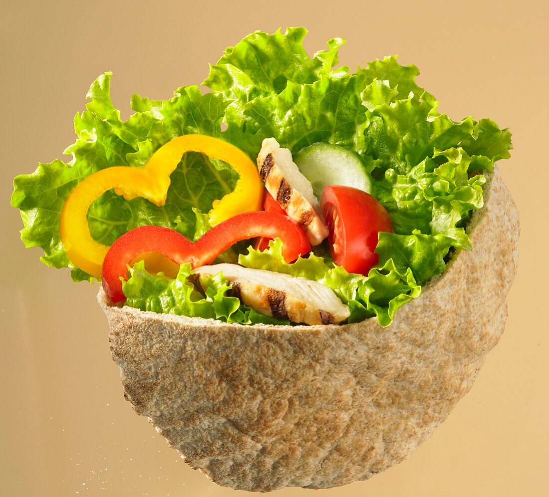 Pitta bread filled with chicken, lettuce and peppers