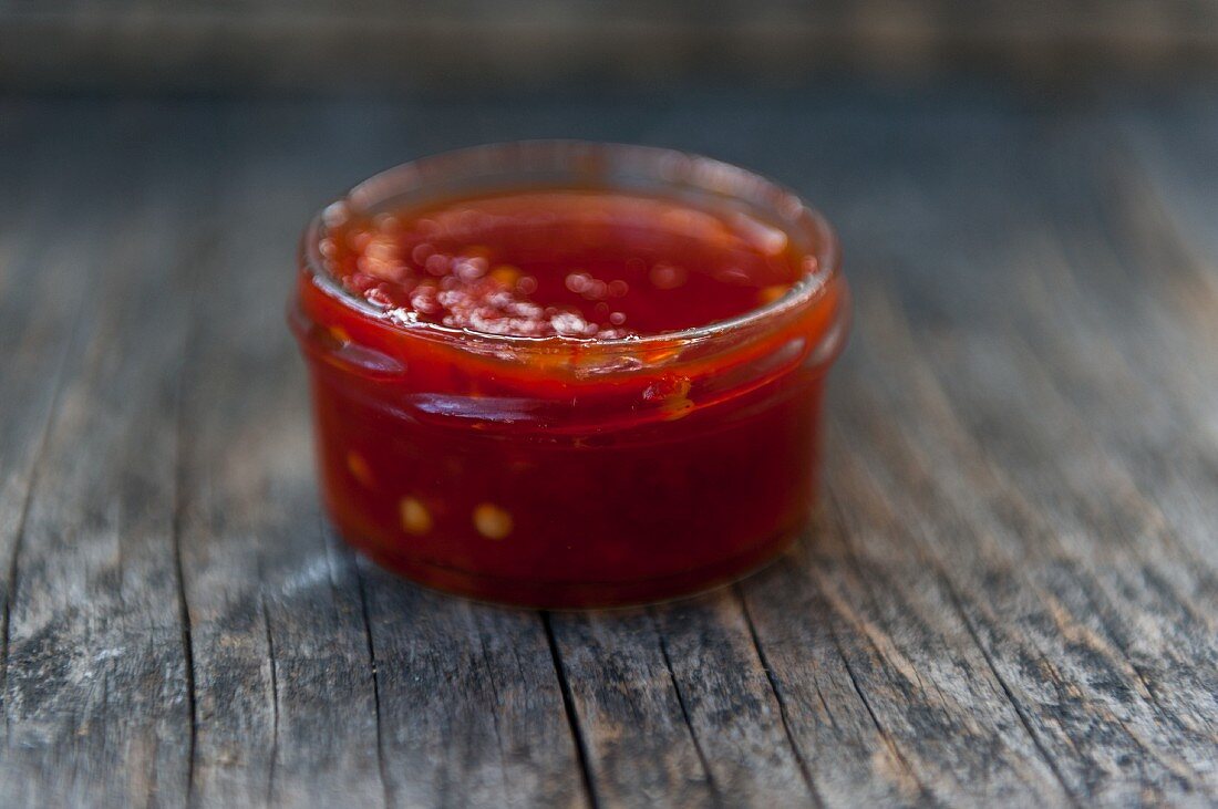 A jar with red chili jam