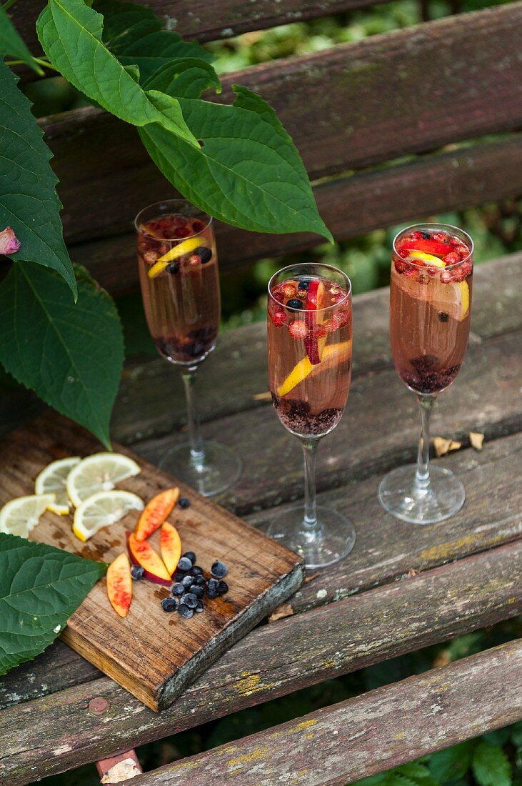 Three glasses with cold fruit drinks for summer