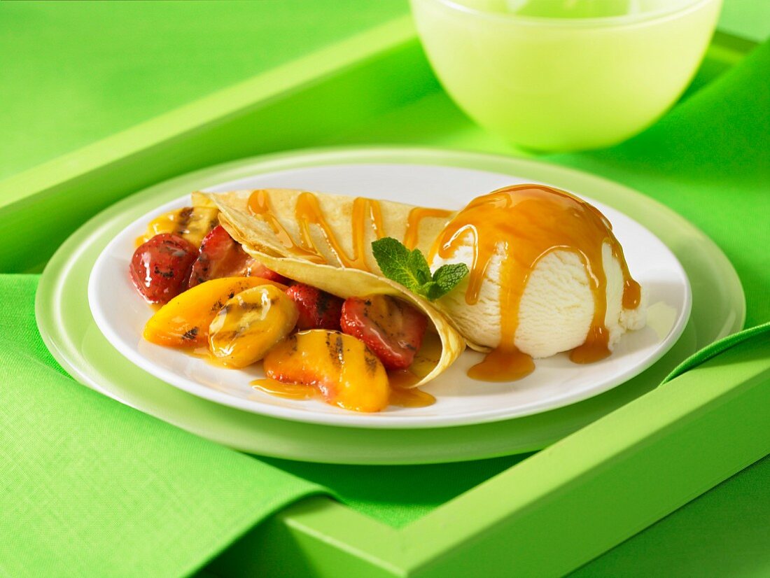 Fruit filled crepe ice cream butterscotch sauce