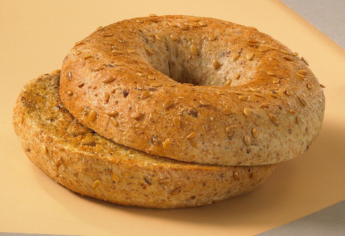 A toasted flaxseed bagel, sliced
