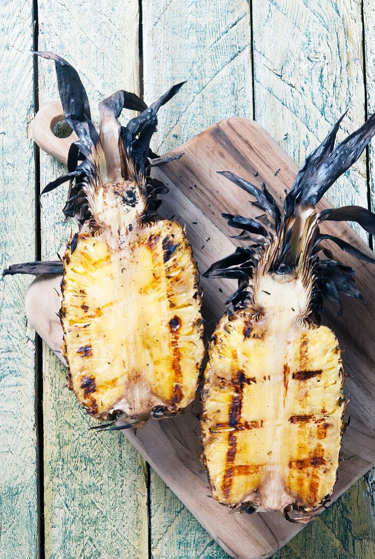 Grilled pineapple sliced in half