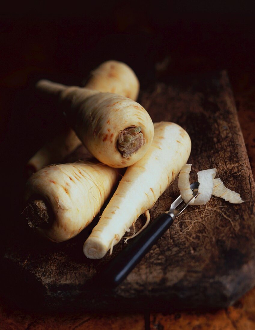 Parsnips on a wooden chopping board