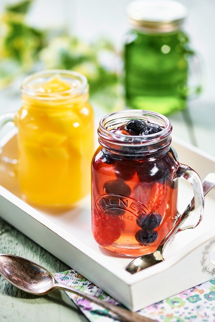 Various fruit jellies in glass jars