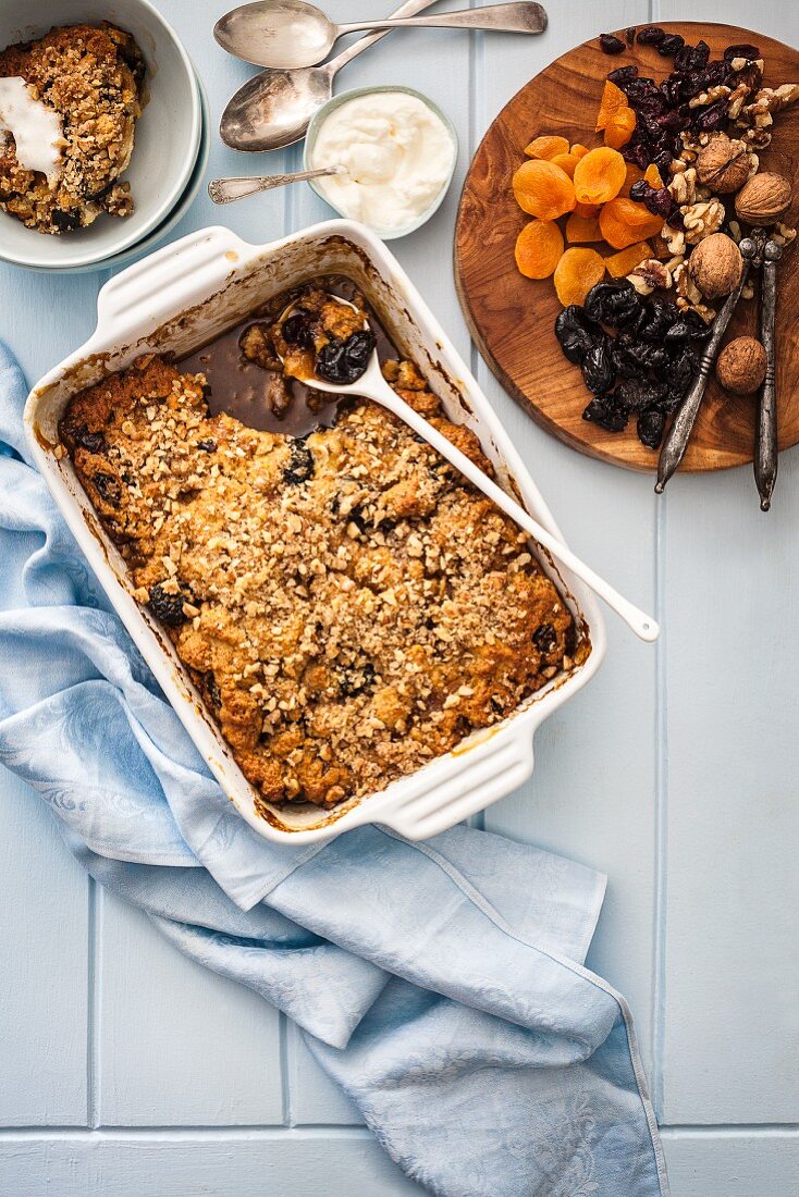 Self-saucing pudding with dried fruits and nuts