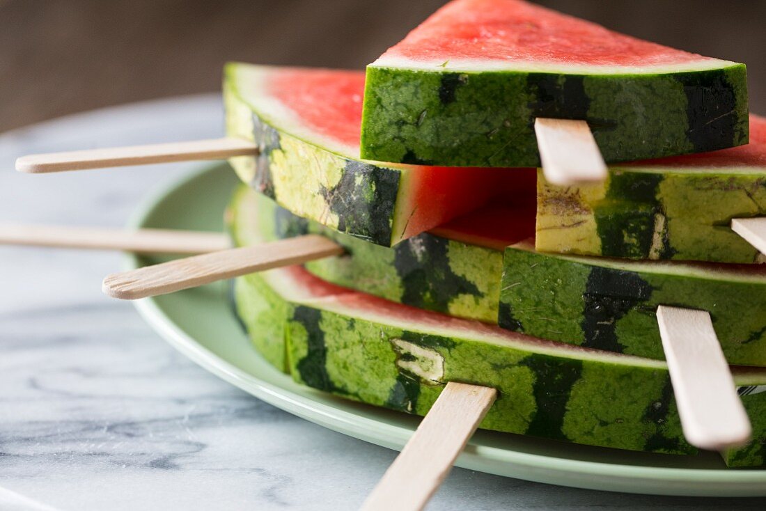 Wedges of watermelon on lollipop sticks