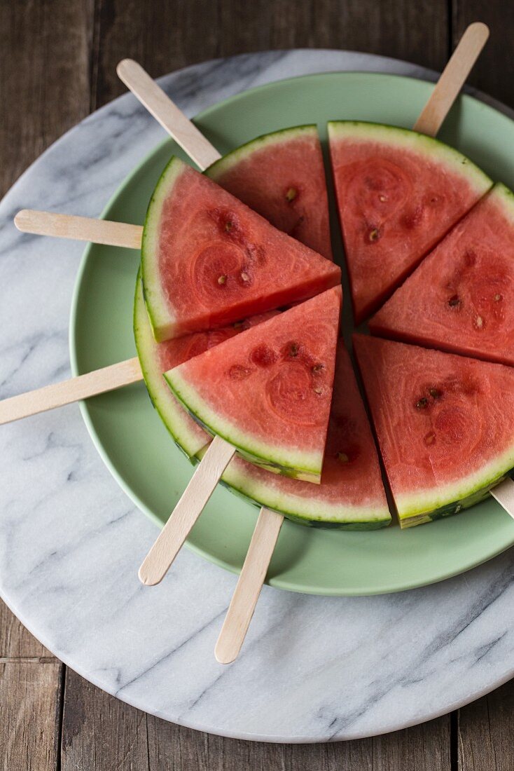Wedges of watermelon on lollipop sticks