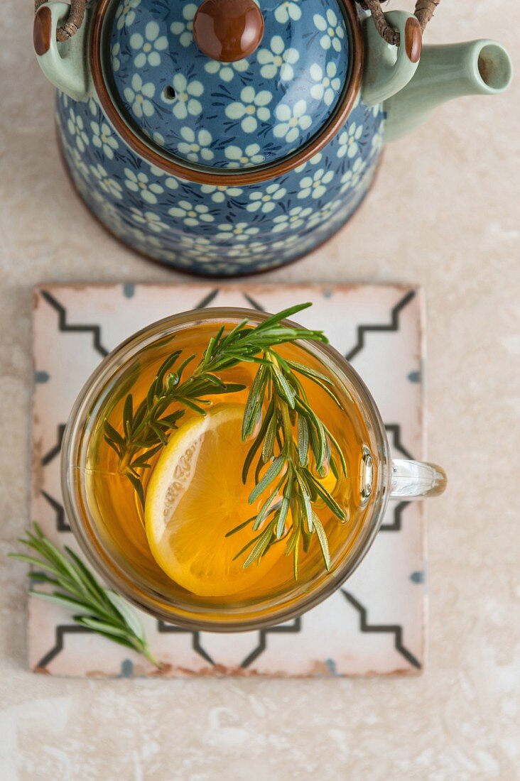 Lemon and rosemary tea in a teacup