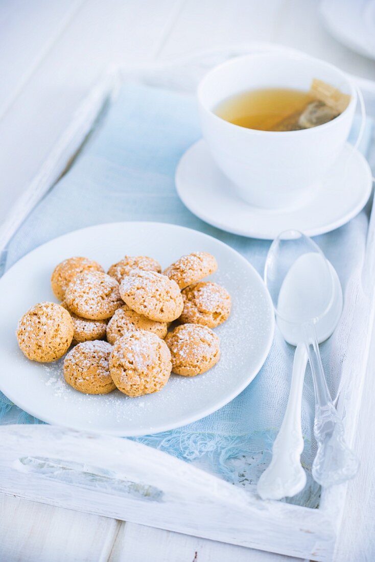 Amaretti biscuits and a teacup