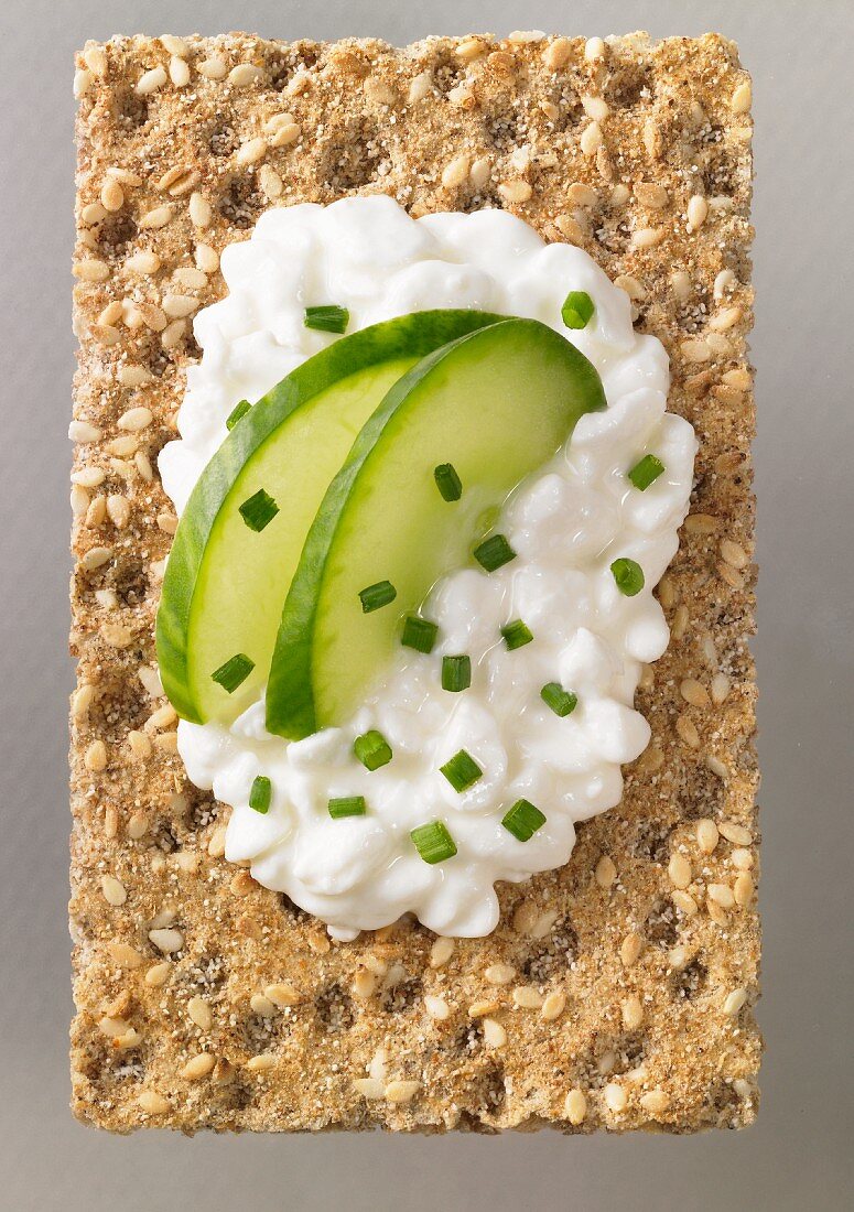 Cottage cheese and cucumbers on a sesame rye crisp
