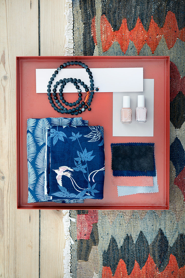 Mood board with fabric swatches, nail polishes and necklace