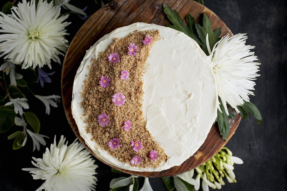 A marzipan almond cake with orange blossom mascarpone frosting, seen from above