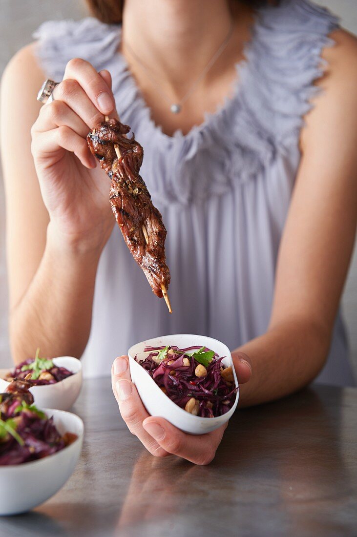 Marinated duck breast skewers with red cabbage