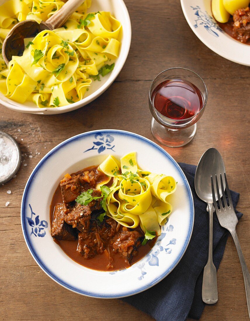Oven cooked goulash with parsley noodles