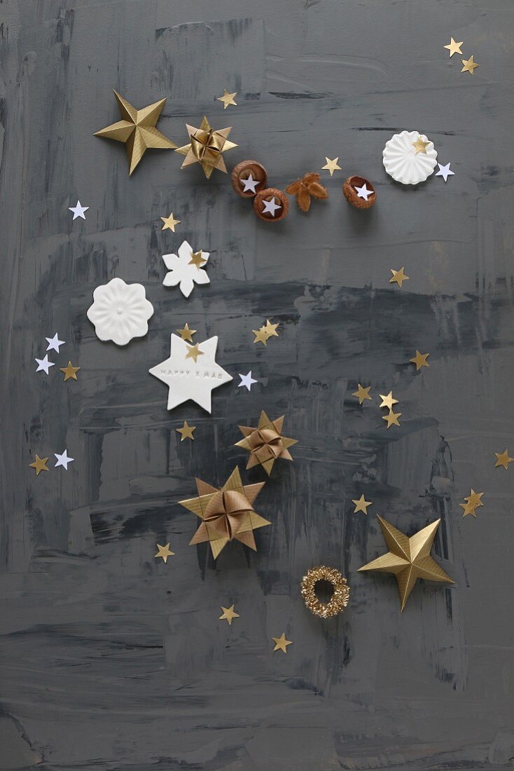 Paper and modelling clay stars on black surface