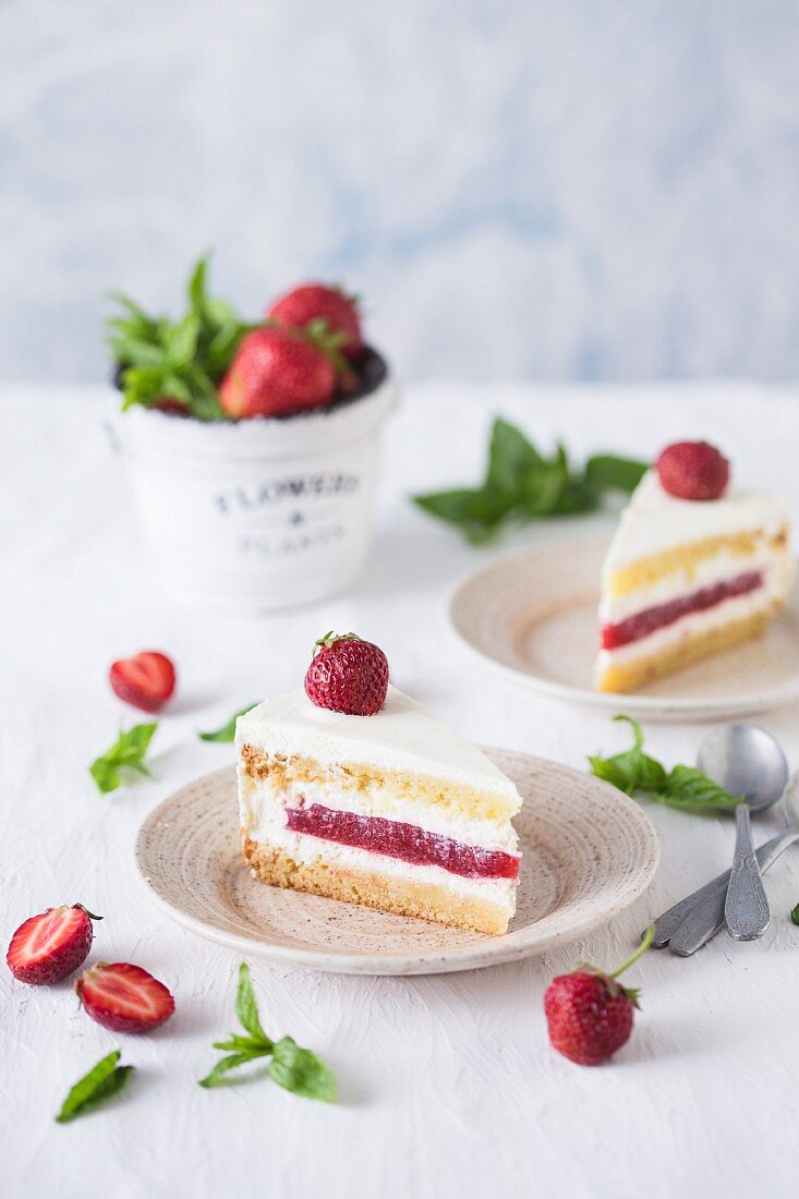 Slices of a strawberry and vanilla cake