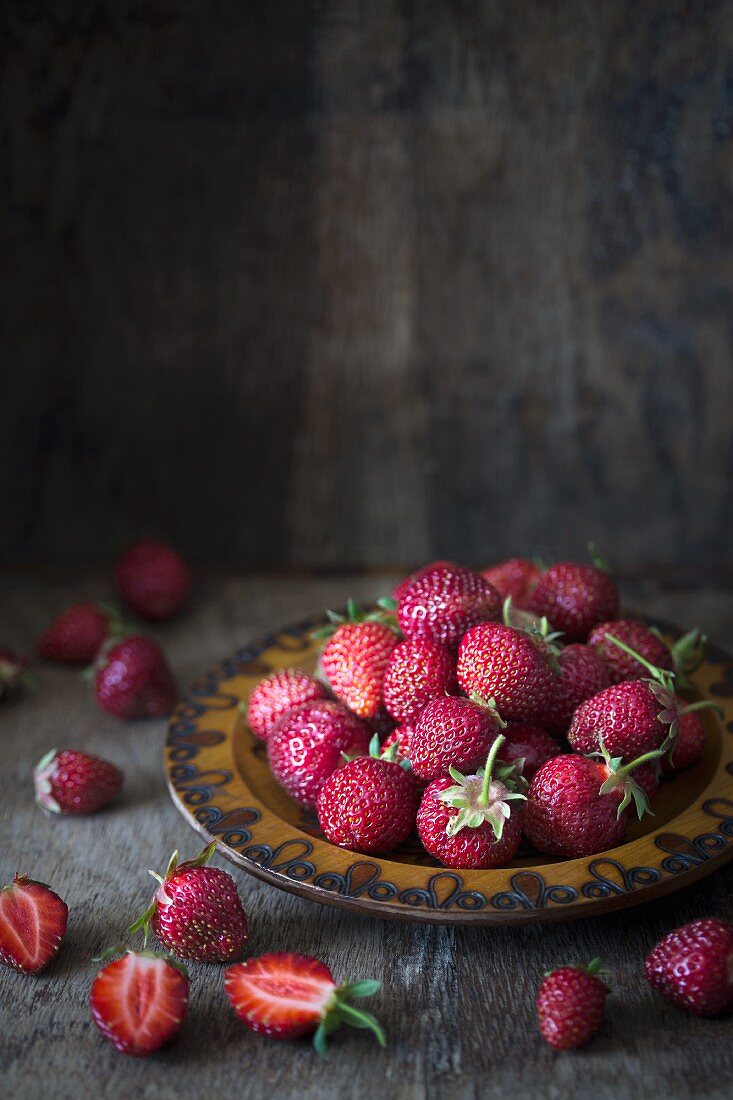 A plate of fresh strawberries