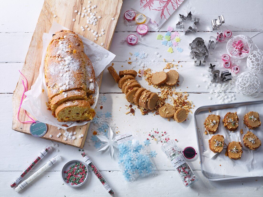 Sliced Christmas stollen, Christmas biscuits, and cookie cutters