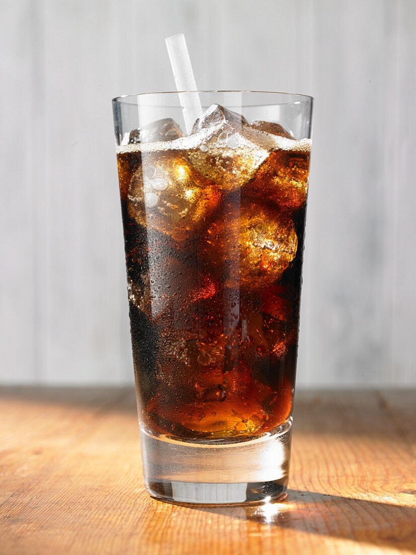 Cola with ice cubes in a glass
