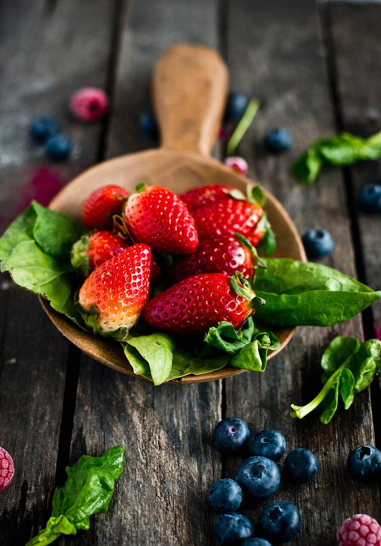 Strawberries, spinach, raspberries and blueberries