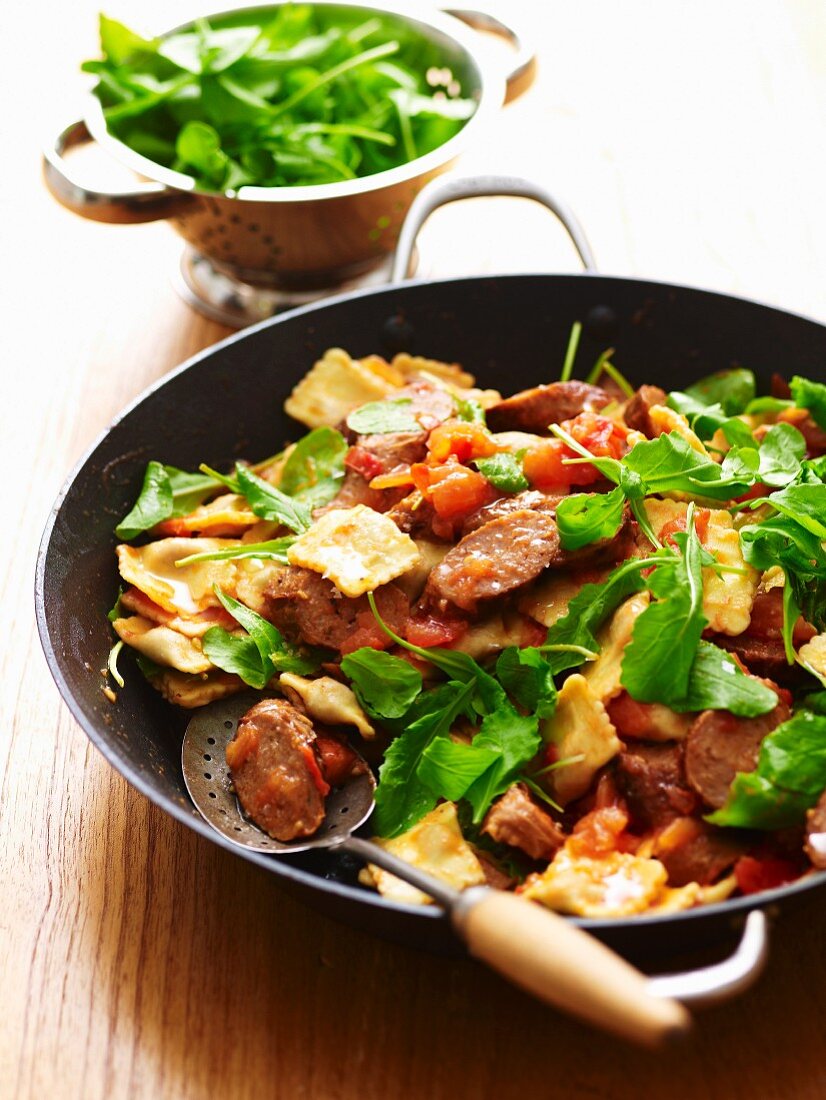 Warm ravioli salad with lamb sausages