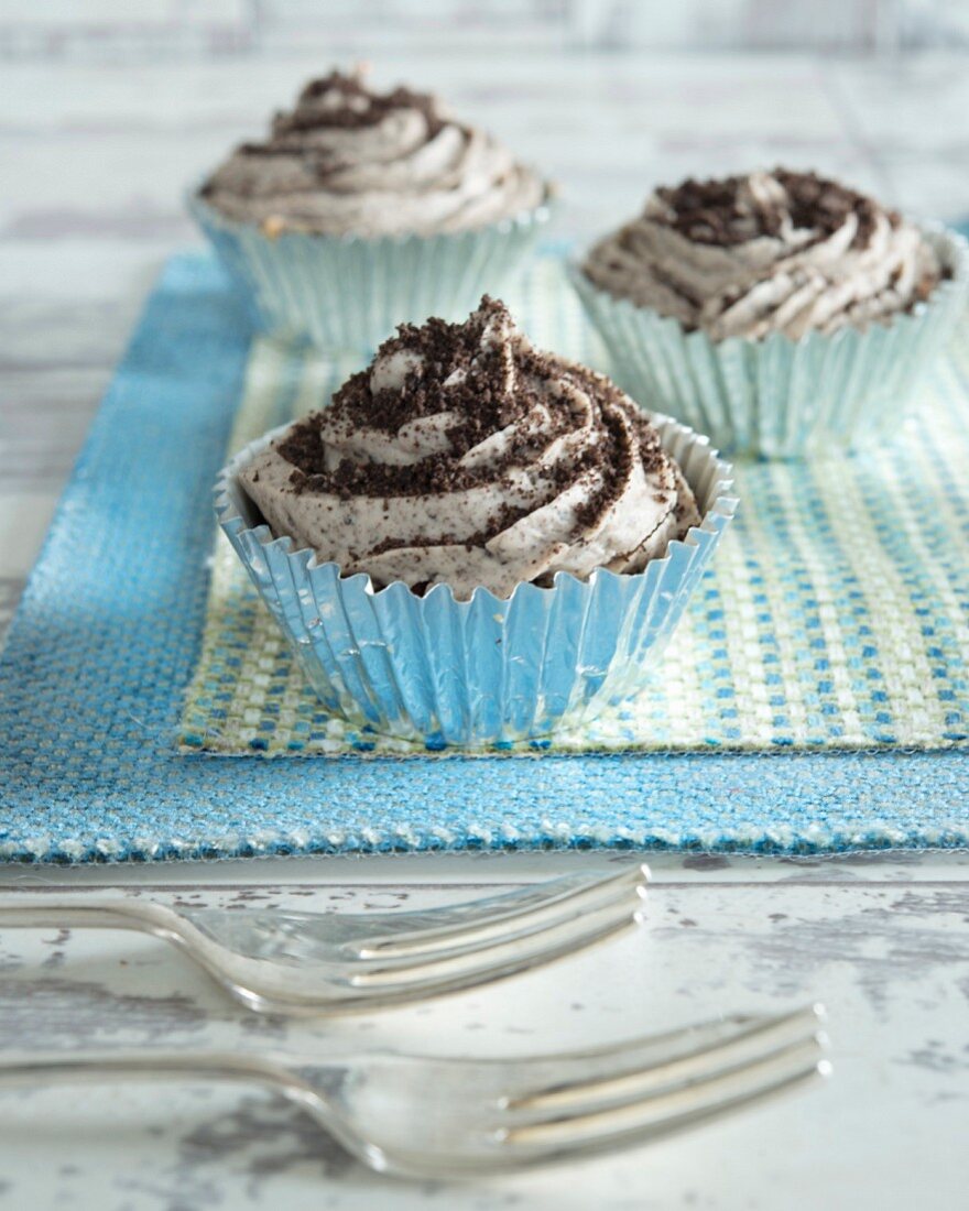 Cupcakes with chocolate biscuit crumbs