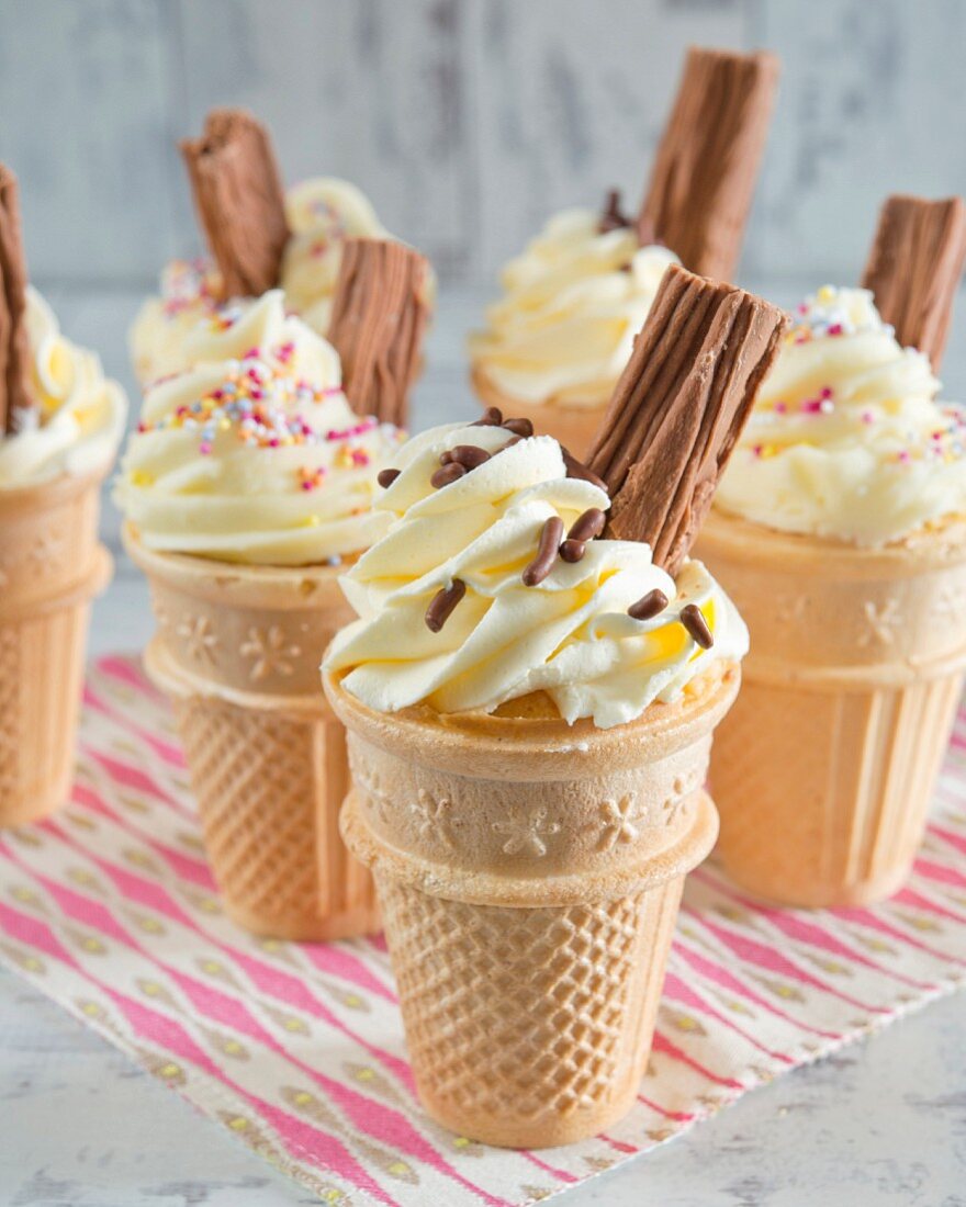 Cupcakes in ice cream cones with chocolate flakes