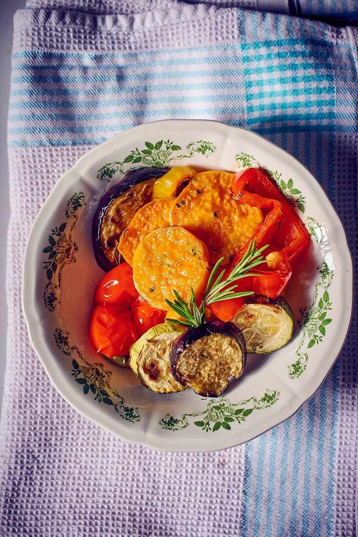 Roasted sweet potatoes and vegetables on a plate