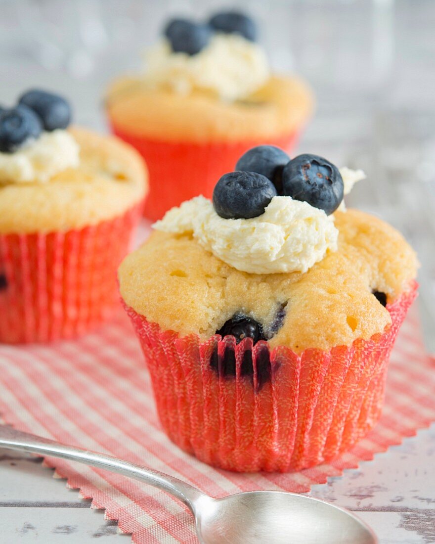 A cupcake with blueberries