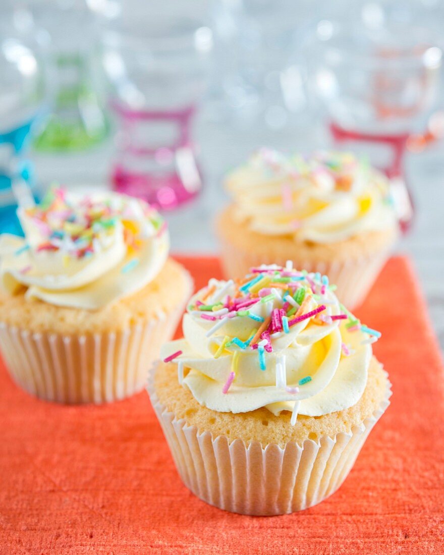 Cupcakes with buttercream and colourful sugar sprinkles