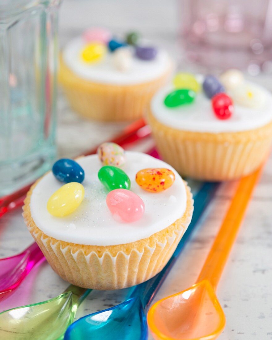 Cupcakes with fondant icing and colourful jelly beans
