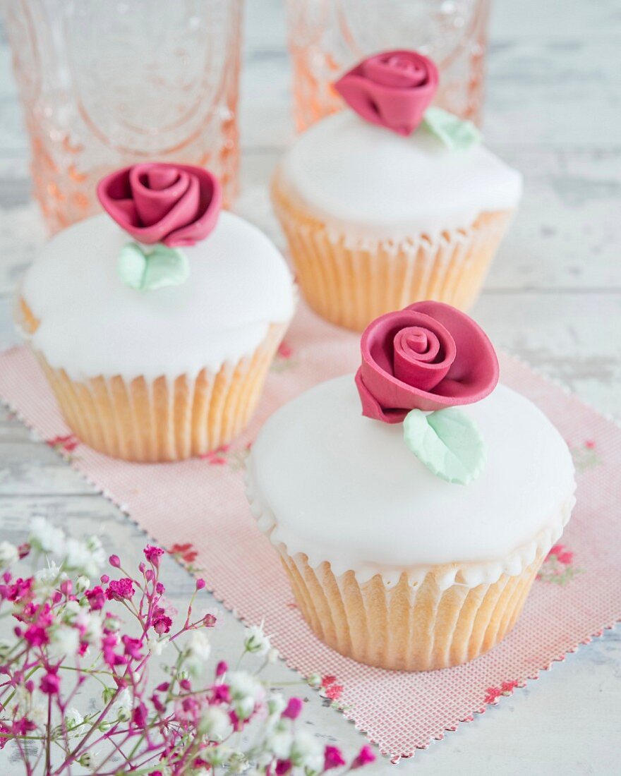 Cupcakes with fondant icing and sugar roses