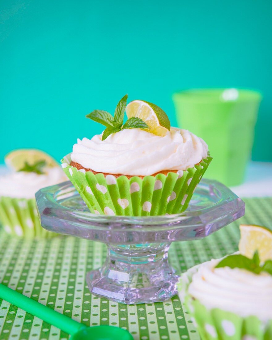 Cupcake with lime frosting and mint