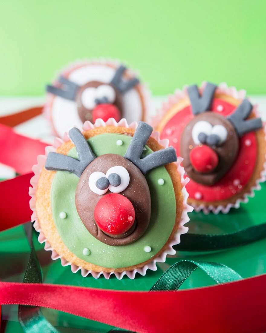 Christmas cupcakes with fondant icing and reindeer faces