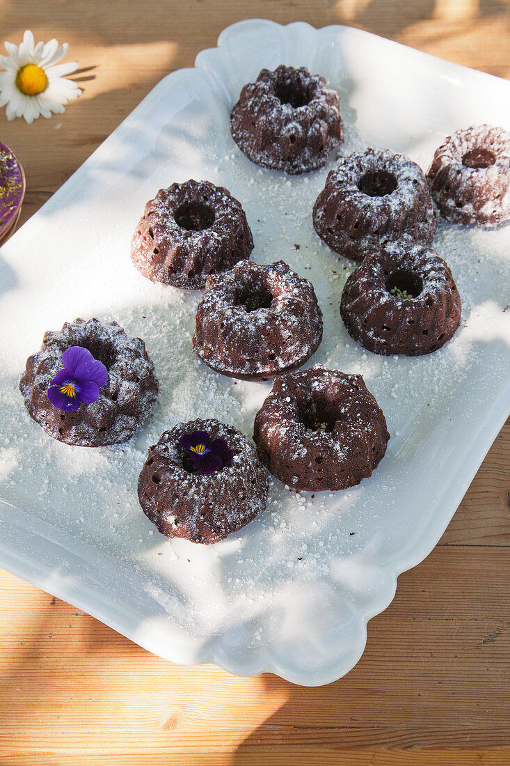 Small brown bundt cakes on vintage napkin