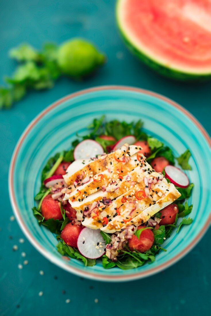Watermelon salad with chicken, rocket and radishes