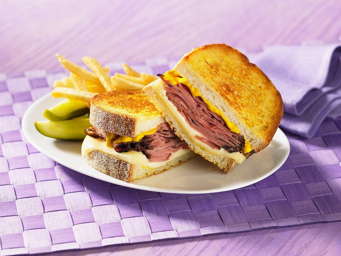 Smoked meat sandwich with cheese and mustard