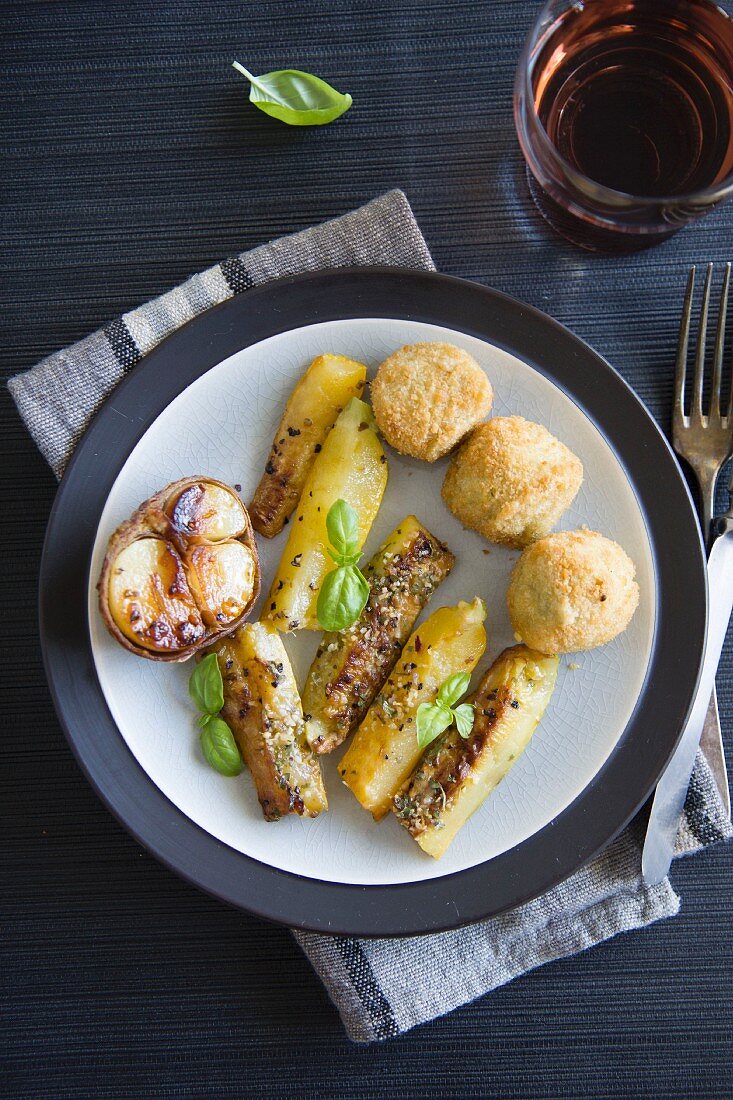 Fried courgette with potato croquettes