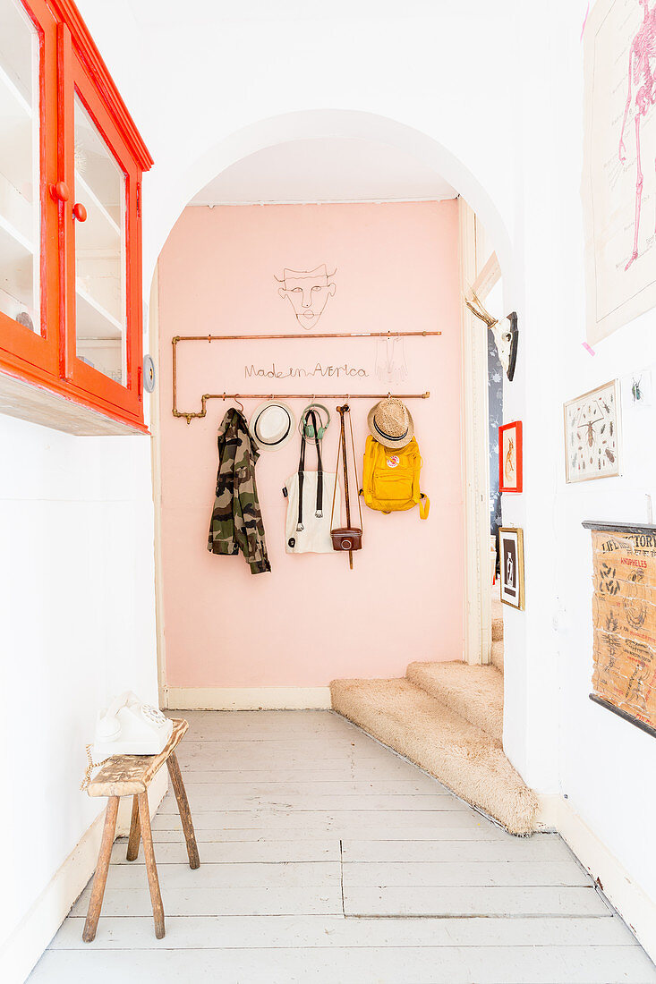 Coat rack made from copper piping in hallway of period apartment