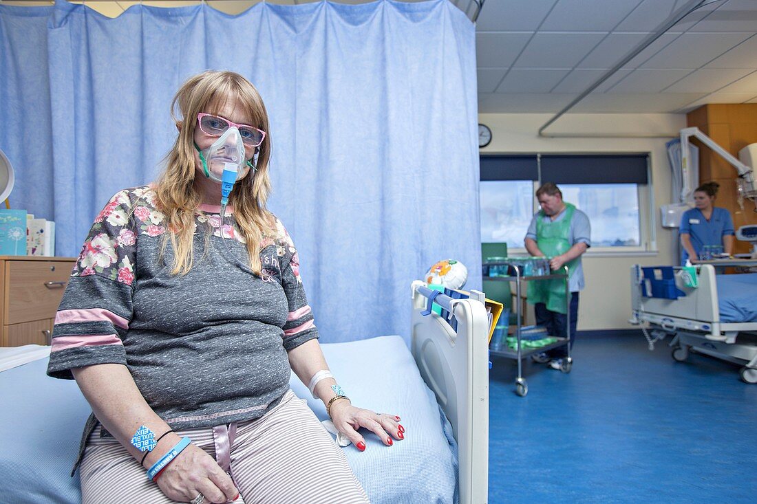 Hospital patient with an oxygen mask