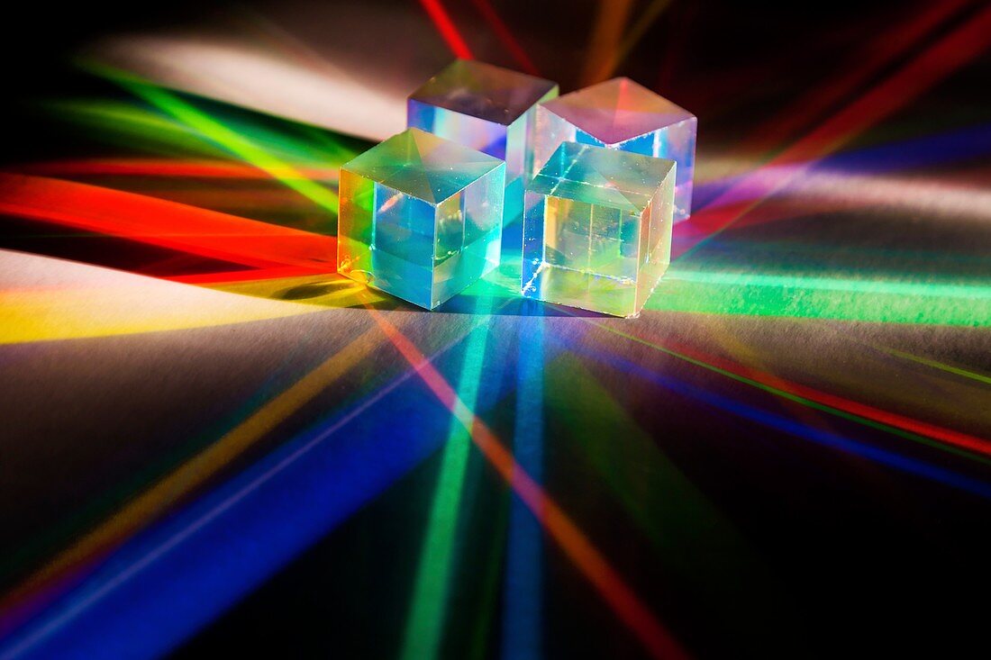 Light shining through RGB prisms from a projector
