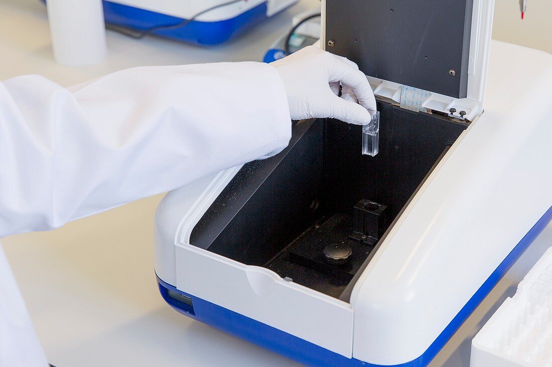 Loading cuvette sample into UV spectrometer