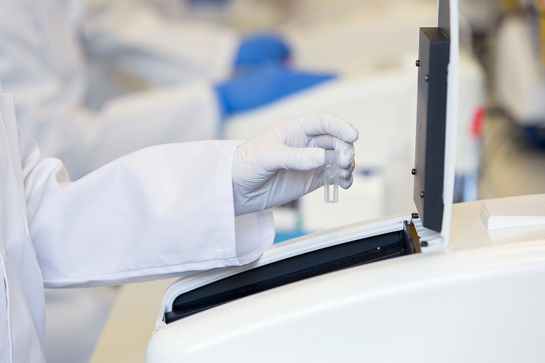 Loading cuvette sample into UV spectrometer